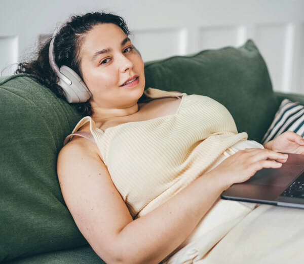 beautiful-overweight-woman-with-laptop-at-home-2023-11-27-05-02-19-utc 1 (1)