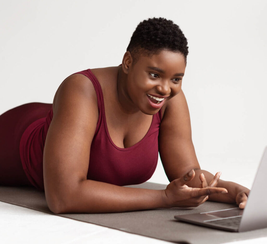 happy-chubby-black-lady-having-video-chat-with-fit-2023-11-27-05-23-35-utc 1 (1)